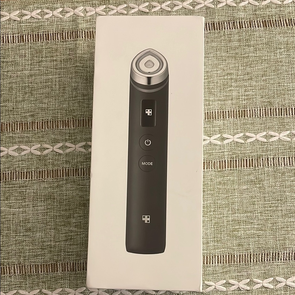 Black Facial Device with Silver Accents